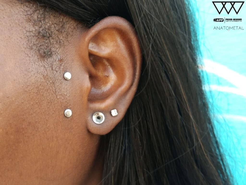 Private Body Piercing Near Menlo Park. Expert, Clean, One-on-One Service A surface piercing featuring titanium disc ends from Anatometal, captured during a follow-up appointment, showcasing the clean placement and smooth healing progress.