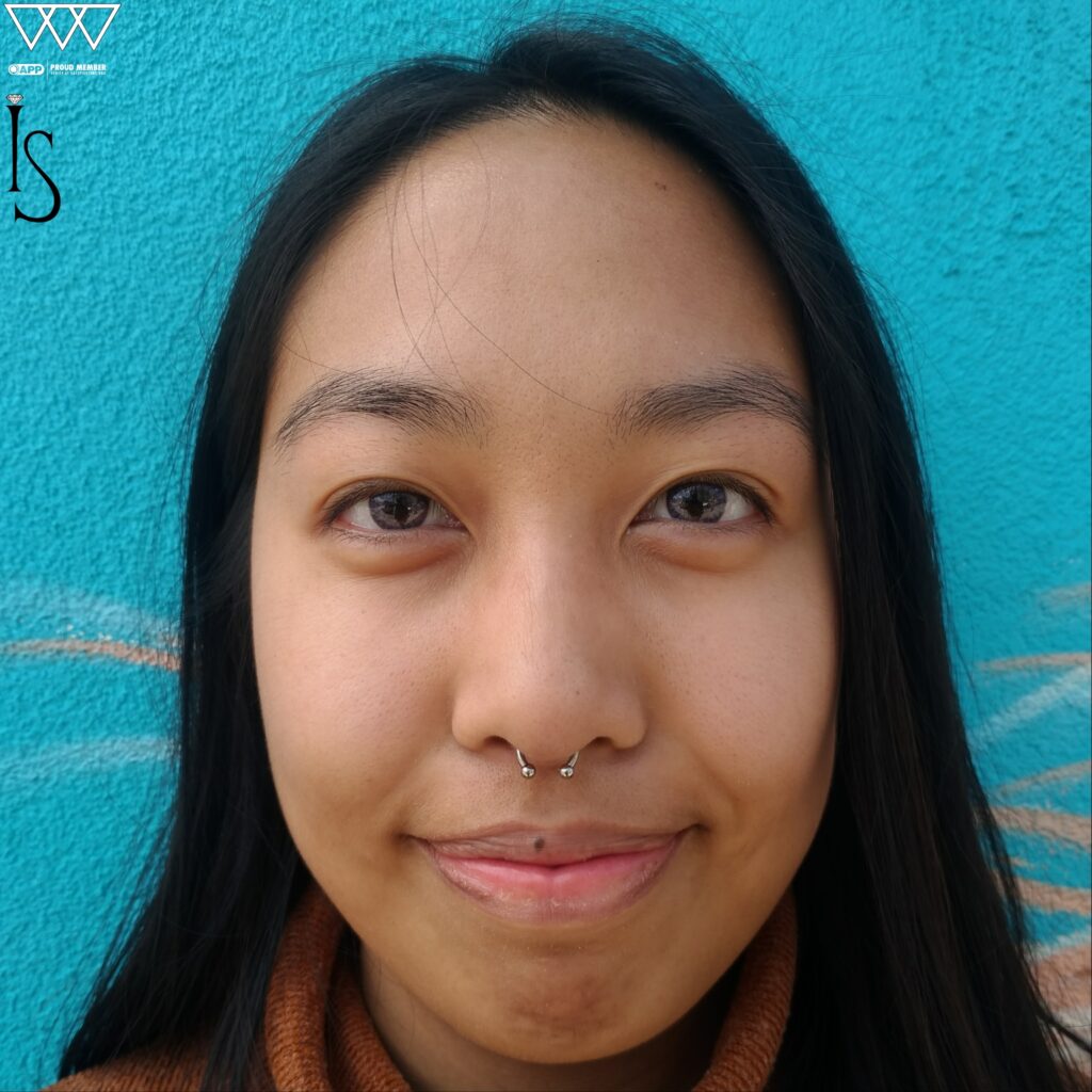 Professional Piercing Studio Near Jersey City. Private Appointments Only A septum piercing featuring a titanium circular barbell from Industrial Strength, freshly placed to correct a previous misalignment and showcase clean, symmetrical positioning.